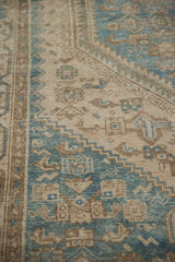 Close-up of the hand-knotted pile showing the sharp serrated contour in dusty blue and sand.
