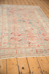 Low perspective of the vintage Mehriban rug's serrated leaf pattern and even-worn pile.