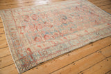 Angled view of the vintage Mehriban rug, highlighting the abrashes in its dusty sky blue field.