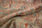 Close view of the textured, low pile and visible knot heads of a vintage Mehriban rug.