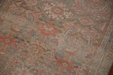 Detailed view of the distressed, low-pile texture and Herati motif on a vintage Hamadan runner.