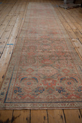 Long perspective view of a vintage Hamadan runner showcasing its allover Herati design.