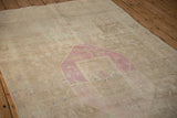 Angled view of the distressed Bijar's pile showing heavy abrashes and wear to the knot heads.