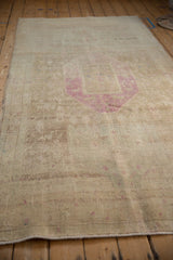 Low angle view highlighting the textured pile and heavy abrashes of a vintage distressed runner.