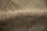 Worn hand-knotted texture showing the knot heads on a distressed vintage Bijar rug.
