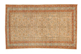 Vintage distressed Persian Mehriban rug with triple diamond medallions in rust, sky blue, and cream.