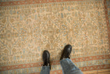 The distressed texture and visible knot heads of a vintage Persian Mehriban rug pile.