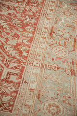 Heriz rug's distressed ruby red field and muted border with turtle samovar elements.
