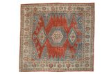 Distressed Persian Veece square carpet in cherry red with geometric triple medallions in sapphire and powder blue.