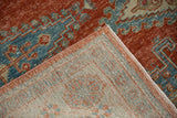 Hand-knotted reverse weave and machine-bound edge of a vintage distressed Persian Veece carpet.