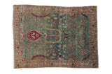 Vintage distressed Meshed rug with a pictorial bird and willow design on a faded blue-green field.