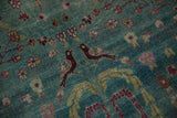 A pair of aubergine birds facing each other on the distressed ocean-blue field of a vintage rug.