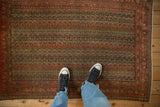 Antique Senneh rug with parallel vine bands, partial Herati Mahi design, faded brick red.