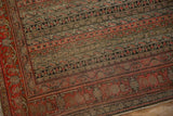 Antique Senneh rug detail: banded field, Herati Mahi motifs, faded red, brown, and ivory.