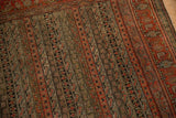 Antique Senneh rug's intricate parallel vine and Herati Mahi pattern in muted reds, browns.