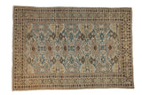 Distressed vintage Tabriz rug with an allover geometric pattern in sapphire, saffron, and pale rose.