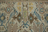Distressed vintage Tabriz rug, featuring ivory, sapphire blue, gold finned guls and starburst florals.