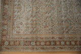 Corner detail of a distressed Persian Mahal showing mostly even wear and a narrow border.