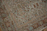 Mostly even wear and low pile texture on a distressed Mahal rug's corner with rustic details.