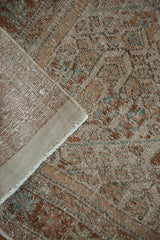 Secured side cord selvage and hand-knotted foundation on a distressed Persian rug.