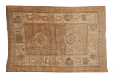 Distressed vintage Persian Afshar rug with a double medallion and animal motifs in soft, neutral earth tones.