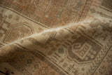 Soft fold showing the worn, low pile of a hand-knotted vintage Afshar rug.