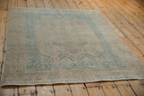 Distressed Afshar rug showing its mostly even wear and soft sand and sky blue tones.