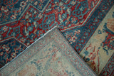 The reverse side of a vintage Senneh rug showing its dense hand-knotted weave and intact selvage.