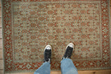 Low-pile texture and time-softened Herati pattern on a distressed vintage Senneh rug.