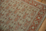 Low pile texture of a vintage Senneh rug with rust turtle samovar motifs on a dusty teal field.