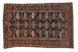 Vintage Kurdish Hamadan rug, dark navy field, allover floral guls, blush, rose, green accents.