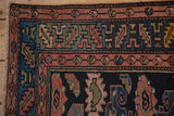 Hand-knotted Kurdish Hamadan rug detail: blush serrated leaf border with navy geometric motifs.