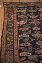 Vintage Kurdish Hamadan rug with blush minor border and navy field featuring stylized Mahi fish.