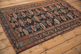 Vintage Kurdish Hamadan rug corner with blush and blue serrated leaf border and secured fringe.
