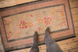 Antique Ningxia rug, beige field, pink floral medallions, blooming branches, running-T border.