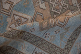 Softly folded vintage Hamadan rug shows mostly even wear and sky blue geometric details.
