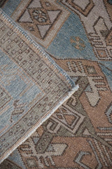 Hand-knotted construction and secured side cord selvage on a vintage Hamadan rug.