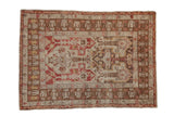 Distressed Anatolian rug with a stepped medallion and pawn motifs in cherry red, coffee brown, and silver.