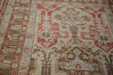 Angled view showing the mostly even wear across the low pile of this vintage Anatolian rug.