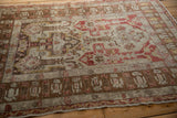Side angle on the distressed texture and pawn motifs of a vintage Anatolian rug.