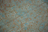 Detailed view of inverted boteh motifs in powder blue and sandalwood on a hand-knotted low pile.