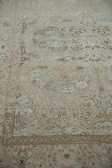 Vintage Meshed rug detail showing dynamic powder blue scrolling floral vines with heavy abrashes.