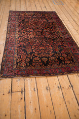 A full-length perspective of an antique Mohajeran Sarouk rug, highlighting its intricate floral sprays.
