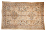 Distressed vintage Tabriz carpet, double medallion, floral patterns, ivory, beige, sapphire blue.