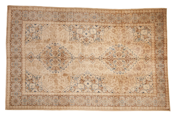 Distressed vintage Tabriz carpet, double medallion, floral patterns, ivory, beige, sapphire blue.