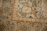 Corner spandrel detail on a vintage Tabriz showing the short pile and Rococo-style leaves.