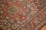 Antique Kashan rug displaying cherry red, sapphire blue, oxidized copper green floral patterns.