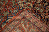 Antique Kashan rug corner showing intricate floral pile, tightly woven foundation, and secured side selvage.