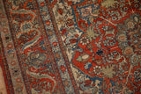 Antique Kashan rug detail: cherry red field, sapphire blue arabesques, and soft green floral vines.