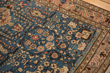 Hand-knotted texture and mostly even wear on the sapphire blue field of a vintage Persian Arak rug.
